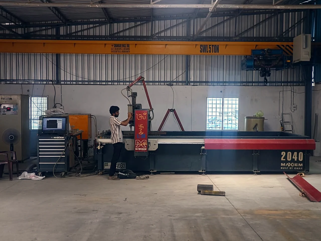 Operator running our MAXIEM 2040 abrasive waterjet machine